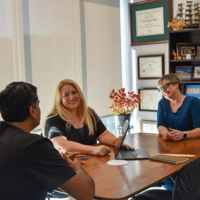 Part 1: intro to mips 2 Bright ideas team members sit around a conference table and discuss business